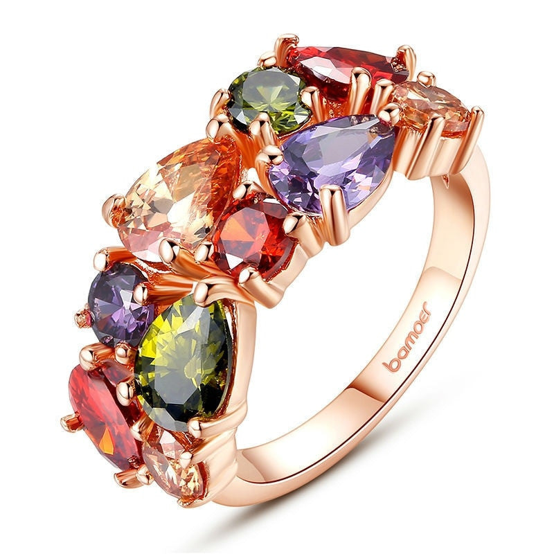 Elegant colored zircon ring with vibrant AAA zircon stones set in 18k gold-plated copper, showcasing a luxurious and colorful design.