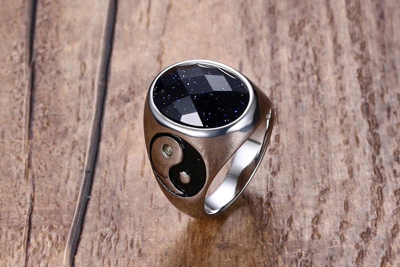 Men's trendy titanium steel ring with black faceted stone and yin-yang side detail. Durable and stylish accessory for modern fashion.